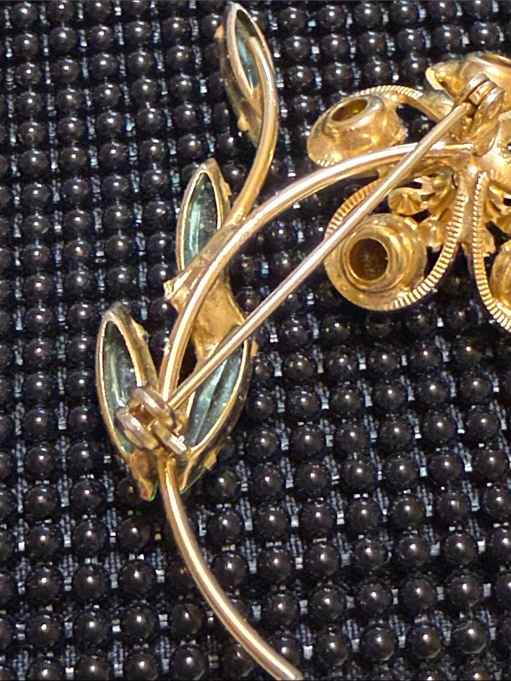 Vintage 70s Gold-Tone Orange Crystal Flower Brooch with Green Leaf Accents